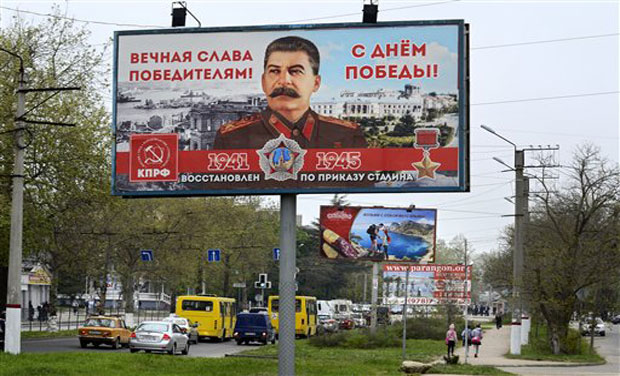 A billboard reading "Eternal glory to the victors" sponsored by the Communist Party, which has always praised Stalin's role in the defeat of Nazi Germany is seen in a street in Sevastopol. (Photo: AP) A billboard reading "Eternal glory to the victors" sponsored by the Communist Party, which has always praised Stalin's role in the defeat of Nazi Germany is seen in a street in Sevastopol. (Photo: AP)