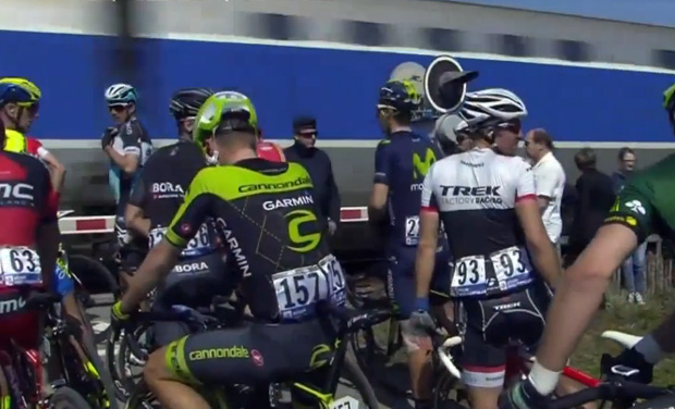 The Paris-Roubaix cycle race came to an abrupt halt as a train passed through the race path. (Photo: Screengrab) The Paris-Roubaix cycle race came to an abrupt halt as a train passed through the race path. (Photo: Screengrab)