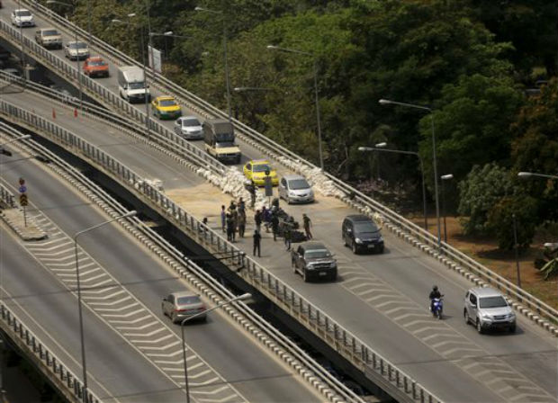 Motorists drive through the street overfly after anti-government protesters remove the barriers on Tuesday. Photo- AP
Motorists drive through the street overfly after anti-government protesters remove the barriers on Tuesday. Photo- AP 