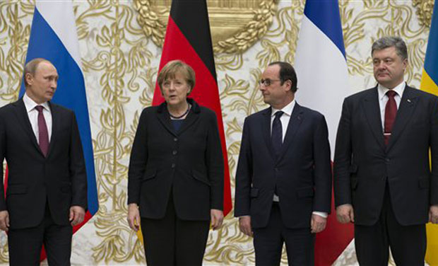 Russian President Vladimir Putin, German Chancellor Angela Merkel, French President Francois Hollande, and Ukrainian President Petro Poroshenko pose for a photo during a time-break in their peace talks in Minsk, Belarus. (Photo: AP) Russian President Vladimir Putin, German Chancellor Angela Merkel, French President Francois Hollande, and Ukrainian President Petro Poroshenko pose for a photo during a time-break in their peace talks in Minsk, Belarus. (Photo: AP)