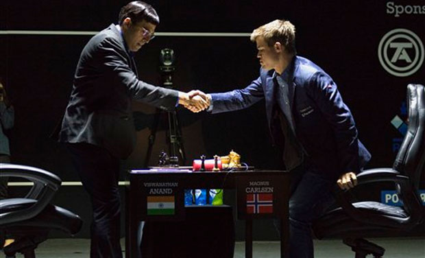Norway's Magnus Carlsen, currently the top ranked chess player in the world, right, shakes hands with India's former World Champion Vishwanathan Anand at the FIDE World Chess Championship Match in Sochi (Photo: AP) Norway's Magnus Carlsen, currently the top ranked chess player in the world, right, shakes hands with India's former World Champion Vishwanathan Anand at the FIDE World Chess Championship Match in Sochi (Photo: AP)