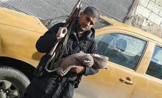 Abu Rumaysah who was born as Siddhartha Dhar, posted the photo on Twitter, proudly posing with an AK-47. (Photo: Twitter) Abu Rumaysah who was born as Siddhartha Dhar, posted the photo on Twitter, proudly posing with an AK-47. (Photo: Twitter)
