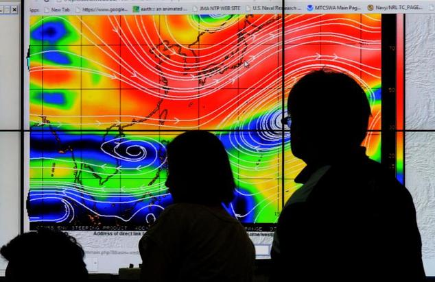 Meteorologists from the Philippine Atmospheric, Geophysical and Astronomical Services Administration (PAGASA) plot the direction of Super Typhoon Hagupit from their control room in Manila. (Photo: AFP) Meteorologists from the Philippine Atmospheric, Geophysical and Astronomical Services Administration (PAGASA) plot the direction of Super Typhoon Hagupit from their control room in Manila. (Photo: AFP)