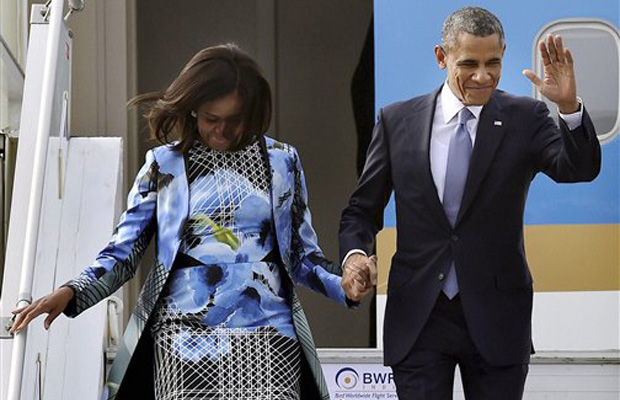 US President Barack Obama and First Lady Michelle Obama upon their arrival at Air Force Station Palam, in New Delhi on Sunday (Photo: AP) US President Barack Obama and First Lady Michelle Obama upon their arrival at Air Force Station Palam, in New Delhi on Sunday (Photo: AP)