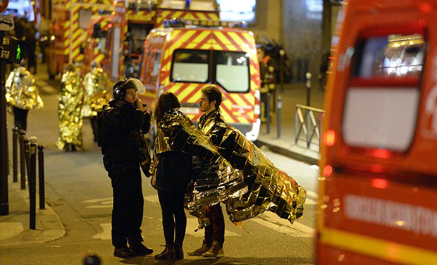 People are being evacuated near the Bataclan concert hall in central Paris, early on November 14, 2015. (Photo: AFP) People are being evacuated near the Bataclan concert hall in central Paris, early on November 14, 2015. (Photo: AFP)