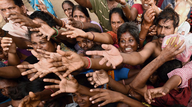 Residents seeking relief materials from volunteers at Kotturpuram, one of the worst flood-hit localities in Chennai (Photo: PTI/File) Residents seeking relief materials from volunteers at Kotturpuram, one of the worst flood-hit localities in Chennai (Photo: PTI/File)