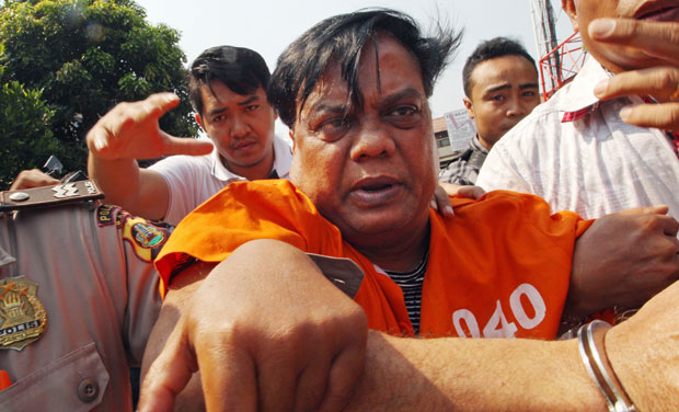 Underworld don Chhota Rajan is escorted by plain-clothed police officers for questioning in Bali, Indonesia (Photo: AP) Underworld don Chhota Rajan is escorted by plain-clothed police officers for questioning in Bali, Indonesia (Photo: AP)