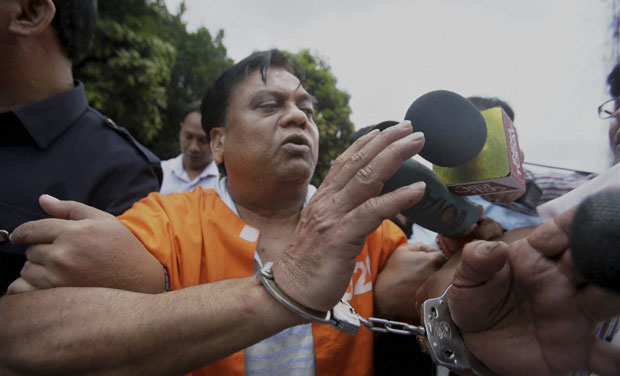 Arrested gangster Chota Rajan is escorted by police officers for questioning in Bali, Indonesia (Photo: PTI) Arrested gangster Chota Rajan is escorted by police officers for questioning in Bali, Indonesia (Photo: PTI)