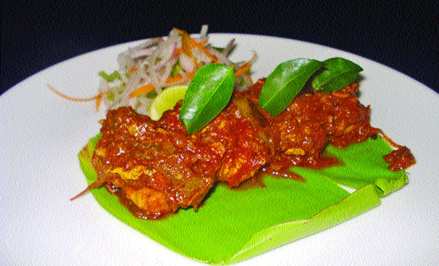 Kozhi pollichathu (pan fried chicken). Kozhi pollichathu (pan fried chicken).