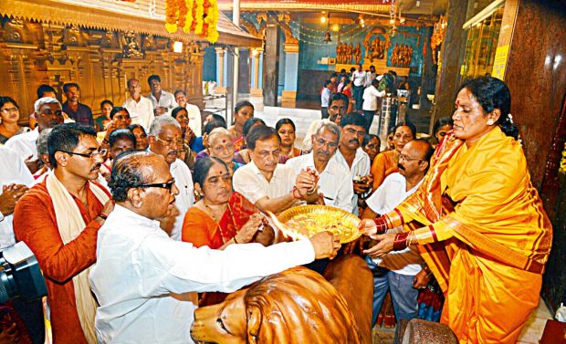 Congress leader Janardhan Poojary with the women priests at Kudroli Sri Gokarnanatha temple in Mangalore Congress leader Janardhan Poojary with the women priests at Kudroli Sri Gokarnanatha temple in Mangalore