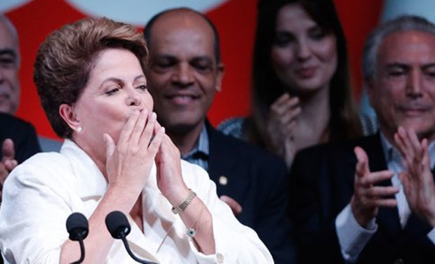 Brazil's President Dilma Rousseff blows kisses to supporters as she celebrates her victory at a hotel in Brasilia, Brazil, Sunday, Oct. 26, 2014. Official results showed Sunday that President Rousseff defeated opposition candidate Aecio Neves of the Brazil's President Dilma Rousseff blows kisses to supporters as she celebrates her victory at a hotel in Brasilia, Brazil, Sunday, Oct. 26, 2014. Official results showed Sunday that President Rousseff defeated opposition candidate Aecio Neves of the