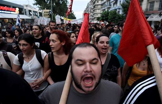 Demonstrators shout slogans during a rally by supporters of the 'No' vote to the upcoming referendum in the northern Greek port city of Thessaloniki, Wednesday, July 1, 2015. Eurozone finance ministers decided Wednesday to break off talks on more Demonstrators shout slogans during a rally by supporters of the 'No' vote to the upcoming referendum in the northern Greek port city of Thessaloniki, Wednesday, July 1, 2015. Eurozone finance ministers decided Wednesday to break off talks on more