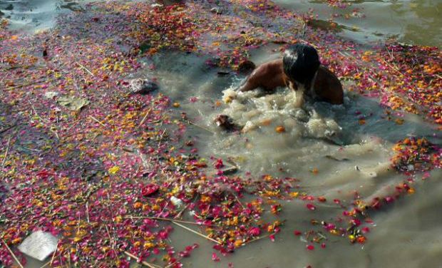 A devotee taking a dip in the polluted waters of river Ganga in Allahabad. (Photo: PTI/File) A devotee taking a dip in the polluted waters of river Ganga in Allahabad. (Photo: PTI/File)