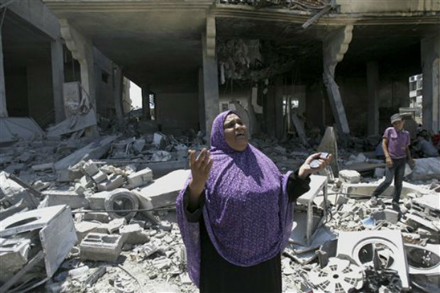 A Palestinian woman gets emotional as she stands on the rubble of a house belong to al Akhras family after it was hit by an Israeli strike in Rafah refugee camp, in the southern Gaza Strip. (Photo: AP) A Palestinian woman gets emotional as she stands on the rubble of a house belong to al Akhras family after it was hit by an Israeli strike in Rafah refugee camp, in the southern Gaza Strip. (Photo: AP)