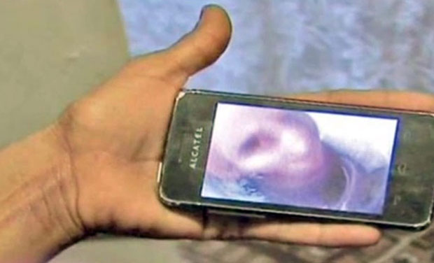 Gina Mihai's mobile phone that shows the 'selfie' taken by her dead grandmother from the other side Gina Mihai's mobile phone that shows the 'selfie' taken by her dead grandmother from the other side