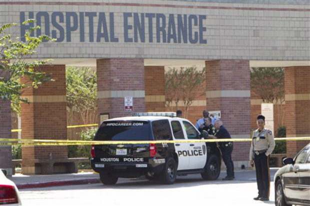 Law enforcement officers stand outside Ben Taub General Hospital following a shooting in the outpatient pharmacy on Wednesday, Oct. 22, 2014, in Houston. Police say a man walked up to a female co-worker in a Ben Taub Hospital pharmacy and shot her Law enforcement officers stand outside Ben Taub General Hospital following a shooting in the outpatient pharmacy on Wednesday, Oct. 22, 2014, in Houston. Police say a man walked up to a female co-worker in a Ben Taub Hospital pharmacy and shot her