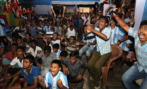 Indian supporters of Argentina cheer during the World Cup final soccer match between Argentina and Germany at a public place, in Kolkata, India, Monday, July 14, 2014. Germany won 1-0. (Photo: AP) Indian supporters of Argentina cheer during the World Cup final soccer match between Argentina and Germany at a public place, in Kolkata, India, Monday, July 14, 2014. Germany won 1-0. (Photo: AP)
