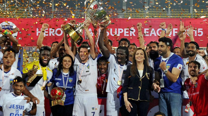 Fatorda: Chennaiyin FC players celebrate with the winning trophy after defeating FC Goa by 3-2 in the finals of the 2nd edition of the ISL at Fatorda in Goa on Sunday. Nita Ambani and Actor Abhishek Bachchan are also seen. (Photo: AP) Fatorda: Chennaiyin FC players celebrate with the winning trophy after defeating FC Goa by 3-2 in the finals of the 2nd edition of the ISL at Fatorda in Goa on Sunday. Nita Ambani and Actor Abhishek Bachchan are also seen. (Photo: AP)