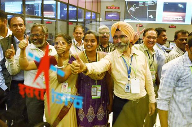 ISRO scientists and other officials celebrate the success of Mars Orbiter Mission at MARS Orbiter Command Network complex in Bengaluru on Wednesday. (Photo: PTI) ISRO scientists and other officials celebrate the success of Mars Orbiter Mission at MARS Orbiter Command Network complex in Bengaluru on Wednesday. (Photo: PTI)