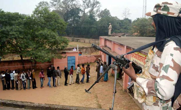 A security personnel keeps vigil at a polling station during 5th phase of Jharkhand Assembly elections in Dumka (Photo: PTI) A security personnel keeps vigil at a polling station during 5th phase of Jharkhand Assembly elections in Dumka (Photo: PTI)