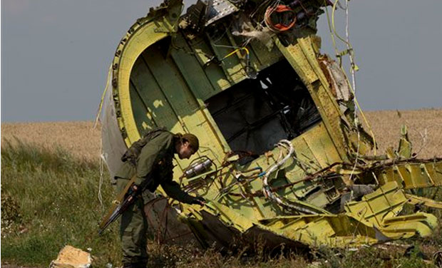 A pro-Russian rebel touches the MH17 wreckage at the crash site of Malaysia Airlines Flight 17, near the village of Hrabove, eastern Ukraine. Ukraine said a passenger plane carrying 295 people was shot down as it flew over the country, and both the A pro-Russian rebel touches the MH17 wreckage at the crash site of Malaysia Airlines Flight 17, near the village of Hrabove, eastern Ukraine. Ukraine said a passenger plane carrying 295 people was shot down as it flew over the country, and both the