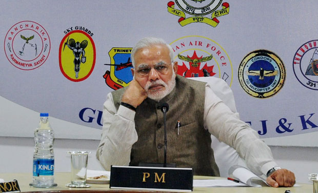 Prime Minister Narendra Modi holds a review meet with Chief Minister Omar Abdullah and other administration officials in Jammu on Sunday. Photo: PTI Prime Minister Narendra Modi holds a review meet with Chief Minister Omar Abdullah and other administration officials in Jammu on Sunday. Photo: PTI