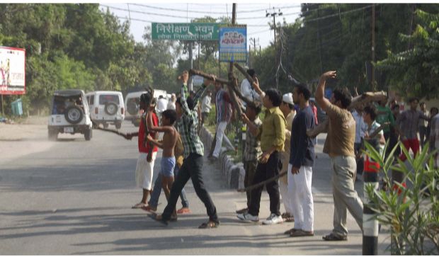 A group shout slogans as security forces arrive to quell communal clashes in Muzaffarnagar (Photo: PTI) A group shout slogans as security forces arrive to quell communal clashes in Muzaffarnagar (Photo: PTI)