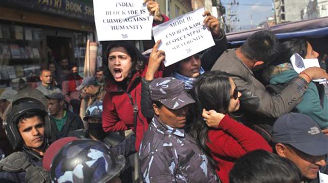 Nepalese activists protesting against India show papers written with their appeal as they are detained by police outside the Indian Embassy in Kathmandu (Photo: AP) Nepalese activists protesting against India show papers written with their appeal as they are detained by police outside the Indian Embassy in Kathmandu (Photo: AP)