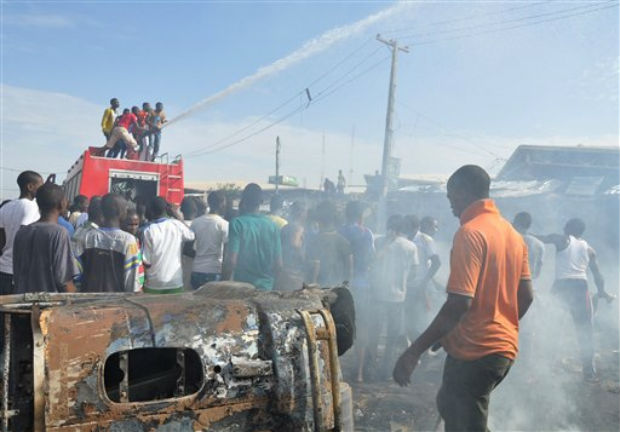 In this Tuesday, July , 2014 file photo, People gather at the scene of a car bomb explosion, at the central market, in Maiduguri, Nigeria. (Photo: AP)
In this Tuesday, July , 2014 file photo, People gather at the scene of a car bomb explosion, at the central market, in Maiduguri, Nigeria. (Photo: AP)