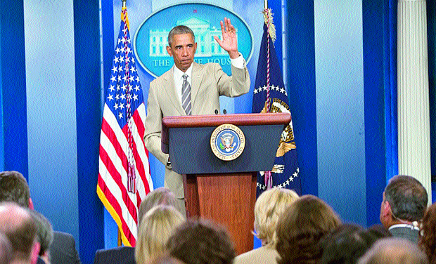 US President Barack Obama wearing a tan suit. (Photo: AFP) US President Barack Obama wearing a tan suit. (Photo: AFP)