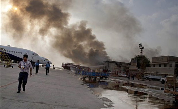 Smoke rises above the Jinnah International Airport, where security forces battled militants in Karachi. (Photo: AP) Smoke rises above the Jinnah International Airport, where security forces battled militants in Karachi. (Photo: AP)