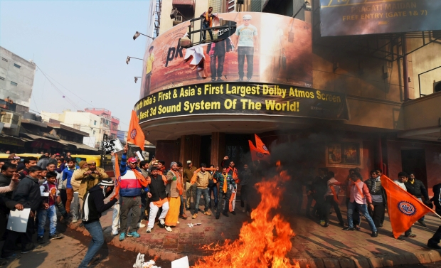 Right wing activists protesting against Aamir Khan starrer 'PK' burn the film's posters outside a movie theatre, in New Delhi on Tuesday (Photo: PTI) Right wing activists protesting against Aamir Khan starrer 'PK' burn the film's posters outside a movie theatre, in New Delhi on Tuesday (Photo: PTI)