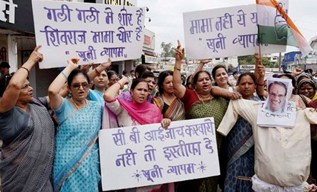 Mahila Congress activists burning an effigy of Madhya Pradesh Chief Minister Shivraj Singh Chouhan demanding his resignation into the death of the people linked with Vyapam scam, in Bhopal on Monday. (Photo: AP) Mahila Congress activists burning an effigy of Madhya Pradesh Chief Minister Shivraj Singh Chouhan demanding his resignation into the death of the people linked with Vyapam scam, in Bhopal on Monday. (Photo: AP)