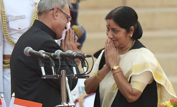 President Pranab Mukherjee greets newly sworn-in minister Sushma Swaraj after administering her the oath at a ceremony at Rashtrapati Bhavan in New Delhi on Monday. (Photo: PTI) President Pranab Mukherjee greets newly sworn-in minister Sushma Swaraj after administering her the oath at a ceremony at Rashtrapati Bhavan in New Delhi on Monday. (Photo: PTI)