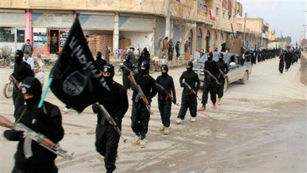This undated file image posted on a militant website on Tuesday, Jan. 14, 2014, which has been verified and is consistent with other AP reporting, shows fighters from the al-Qaida linked Islamic State of Iraq and the Levant (ISIL) marching in Raqqa This undated file image posted on a militant website on Tuesday, Jan. 14, 2014, which has been verified and is consistent with other AP reporting, shows fighters from the al-Qaida linked Islamic State of Iraq and the Levant (ISIL) marching in Raqqa