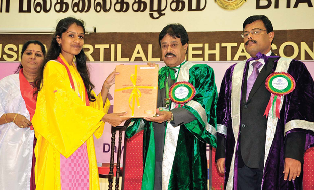 Bharathiar University vice chancellor James Pitchai gives away degree certificates during graduation day in Coimbatore on Friday. In a break with tradition, the varsity presented degree certificates to all its students - from graduates to Ph.D Bharathiar University vice chancellor James Pitchai gives away degree certificates during graduation day in Coimbatore on Friday. In a break with tradition, the varsity presented degree certificates to all its students - from graduates to Ph.D