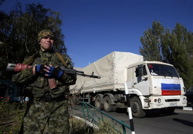 A pro-Russian rebel guards convoy of white trucks with humanitarian aid from Russia in the town of Donetsk, eastern Ukraine, Saturday, Sept. 20, 2014. Picture used for representational purpose only. (Photo: AP) A pro-Russian rebel guards convoy of white trucks with humanitarian aid from Russia in the town of Donetsk, eastern Ukraine, Saturday, Sept. 20, 2014. Picture used for representational purpose only. (Photo: AP)