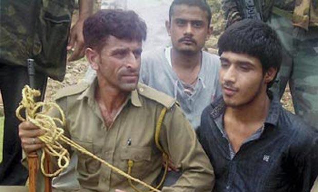 Police with a Pakistani terrorist after an attack on BSF convoy at Jammu-Srinagar national highway at Udhampur district of Jammu and Kashmir. (Photo: PTI) Police with a Pakistani terrorist after an attack on BSF convoy at Jammu-Srinagar national highway at Udhampur district of Jammu and Kashmir. (Photo: PTI)