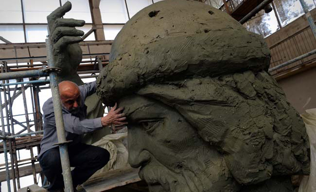 Russian sculptor looking at a model for a monument to Vladimir the Great in Moscow. (Photo: AFP) Russian sculptor looking at a model for a monument to Vladimir the Great in Moscow. (Photo: AFP)