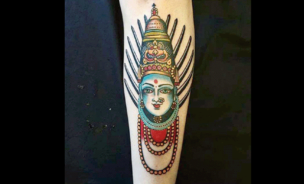 The tattoo of Goddess Yellamma on Matt's shin The tattoo of Goddess Yellamma on Matt's shin