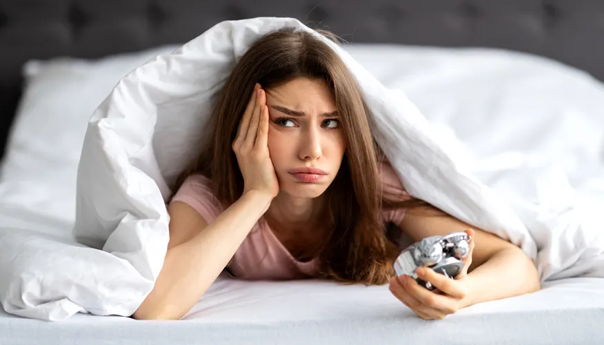 What is defined as oversleeping?