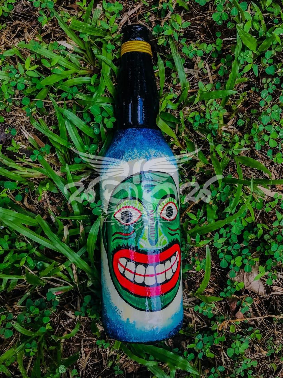 The Traditional Kolam Mask Faces on Bottle