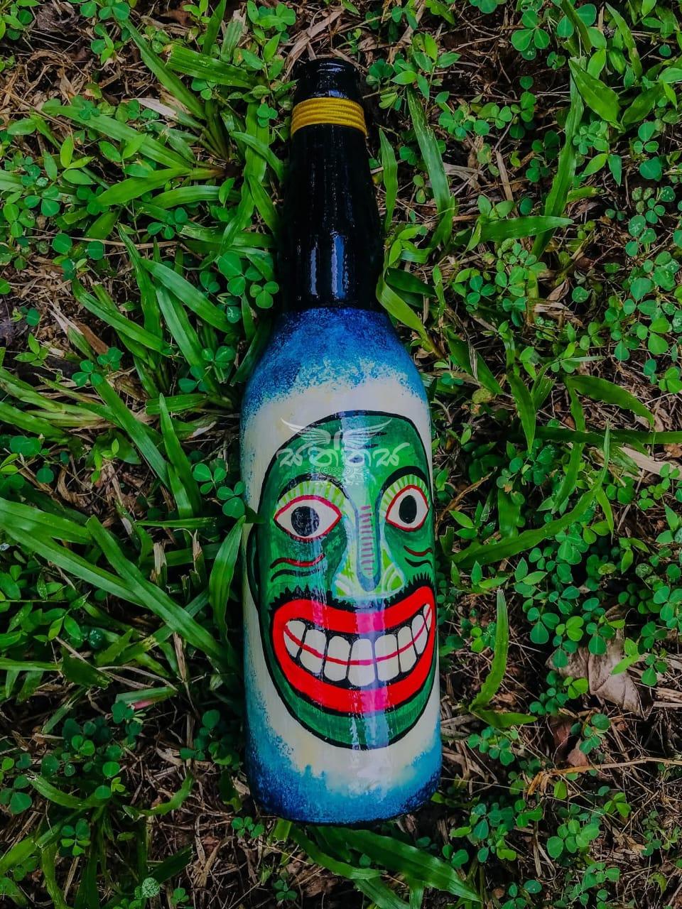 The Traditional Kolam Mask Faces on Bottle
