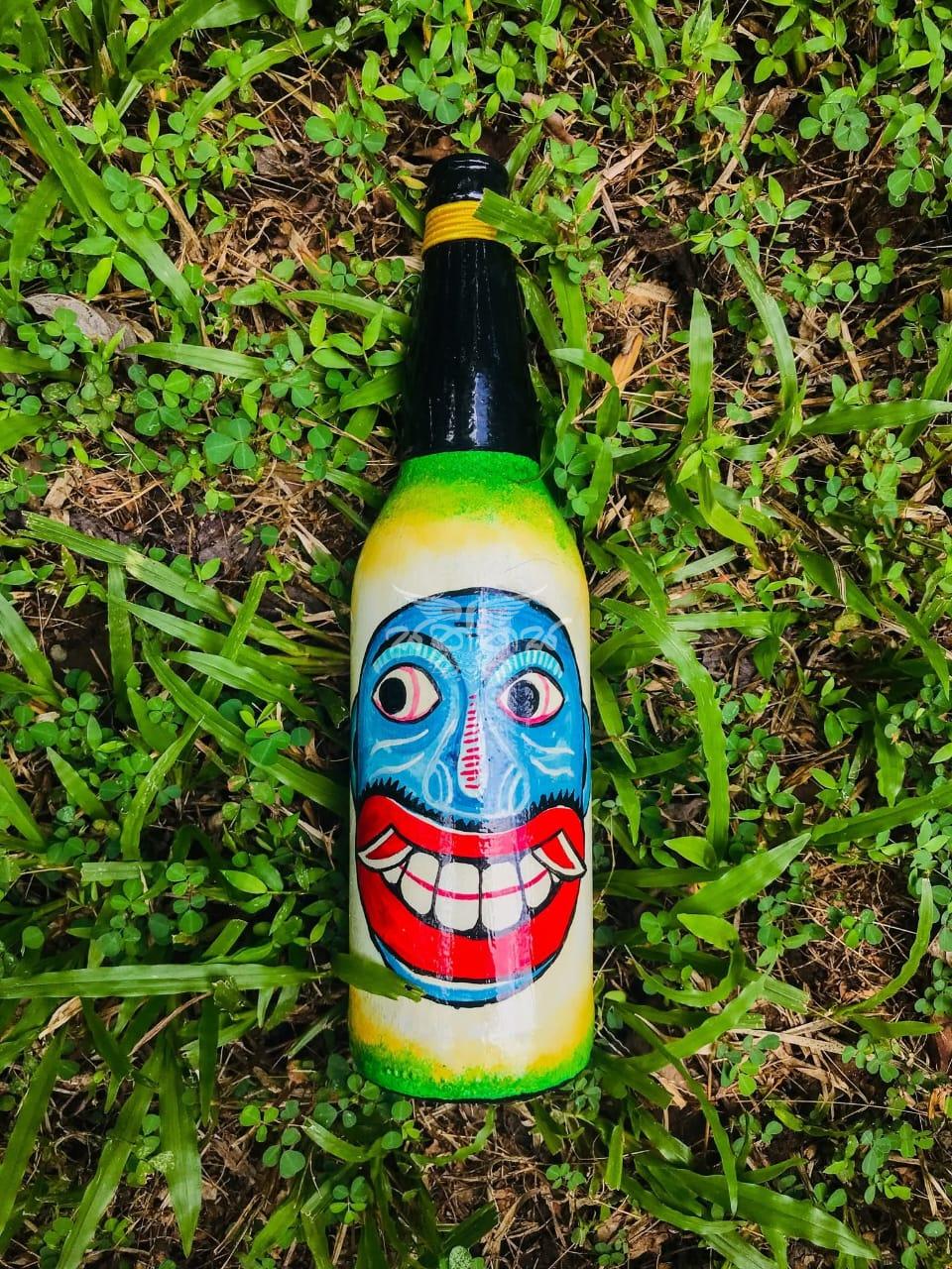 The Traditional Kolam Mask Faces on Bottle