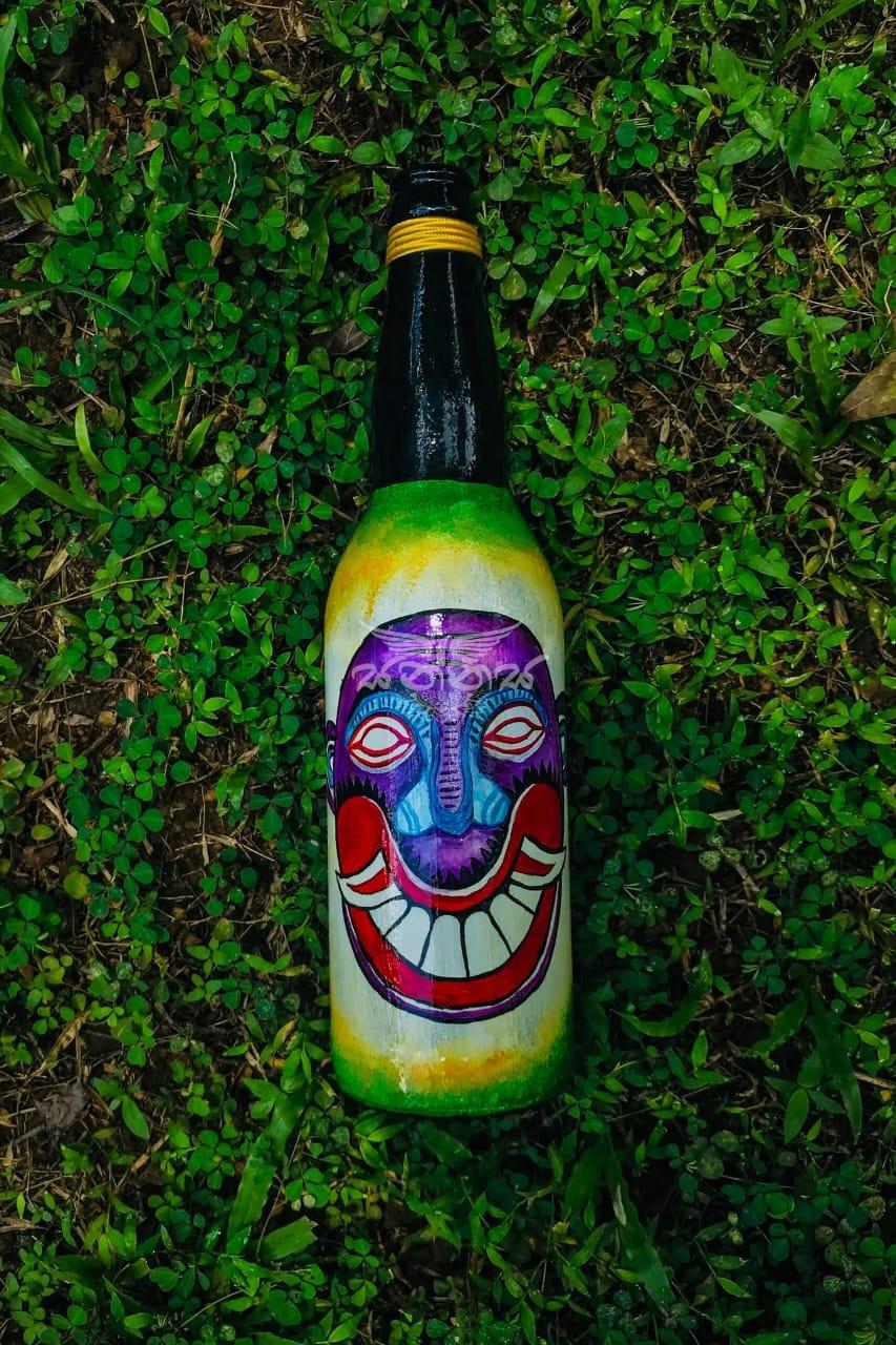 The Traditional Kolam Mask Faces on Bottle