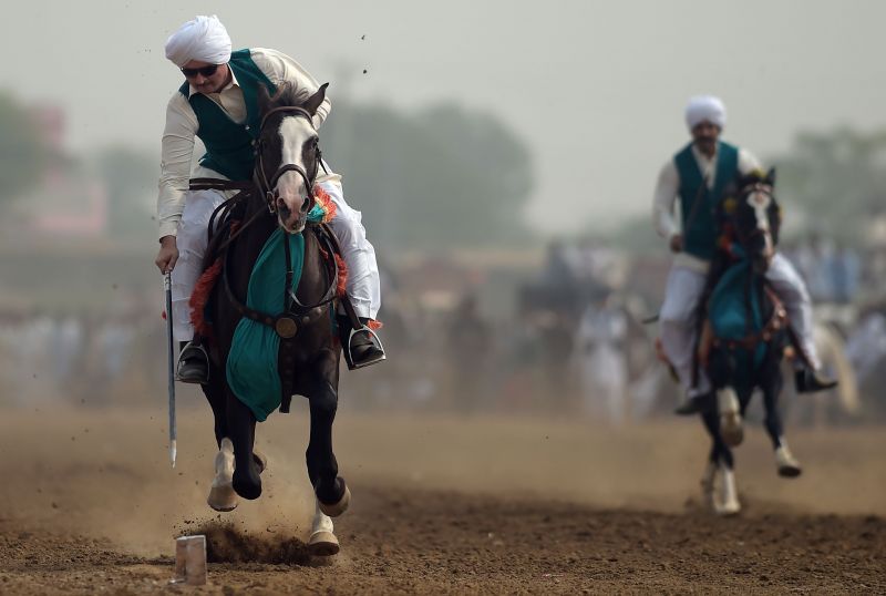 Pakistan Horse riders show off their skills during Kot Fateh Khan mela