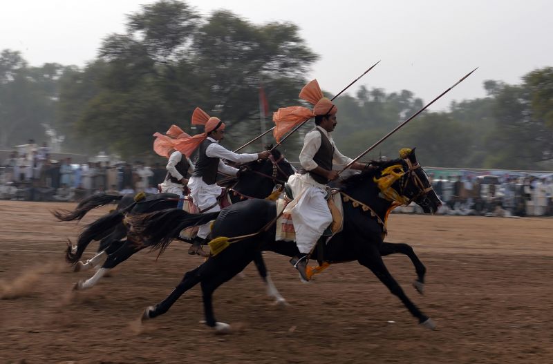 Pakistan Horse riders show off their skills during Kot Fateh Khan mela