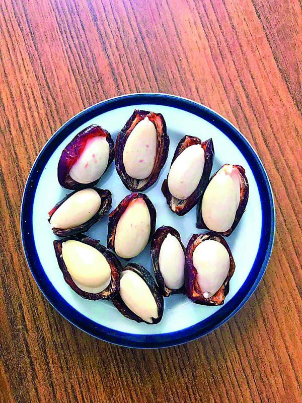 Soaked Almonds in date halves