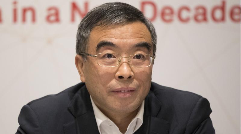 Liang spoke to reporters after the Chinese telecommunications company said it would increase Canadian research and development investment by 15 per cent this year and add 200 R&D jobs, expanding its workforce by 20 per cent. (Photo: AP)