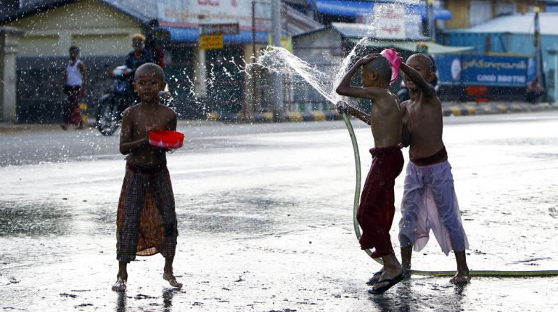 Myanmar Water Festival: Revelers celebrate descent of Thagyamin to Earth.